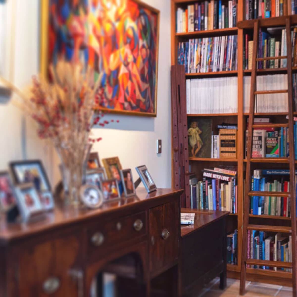 Inside house looking at a bookshelf